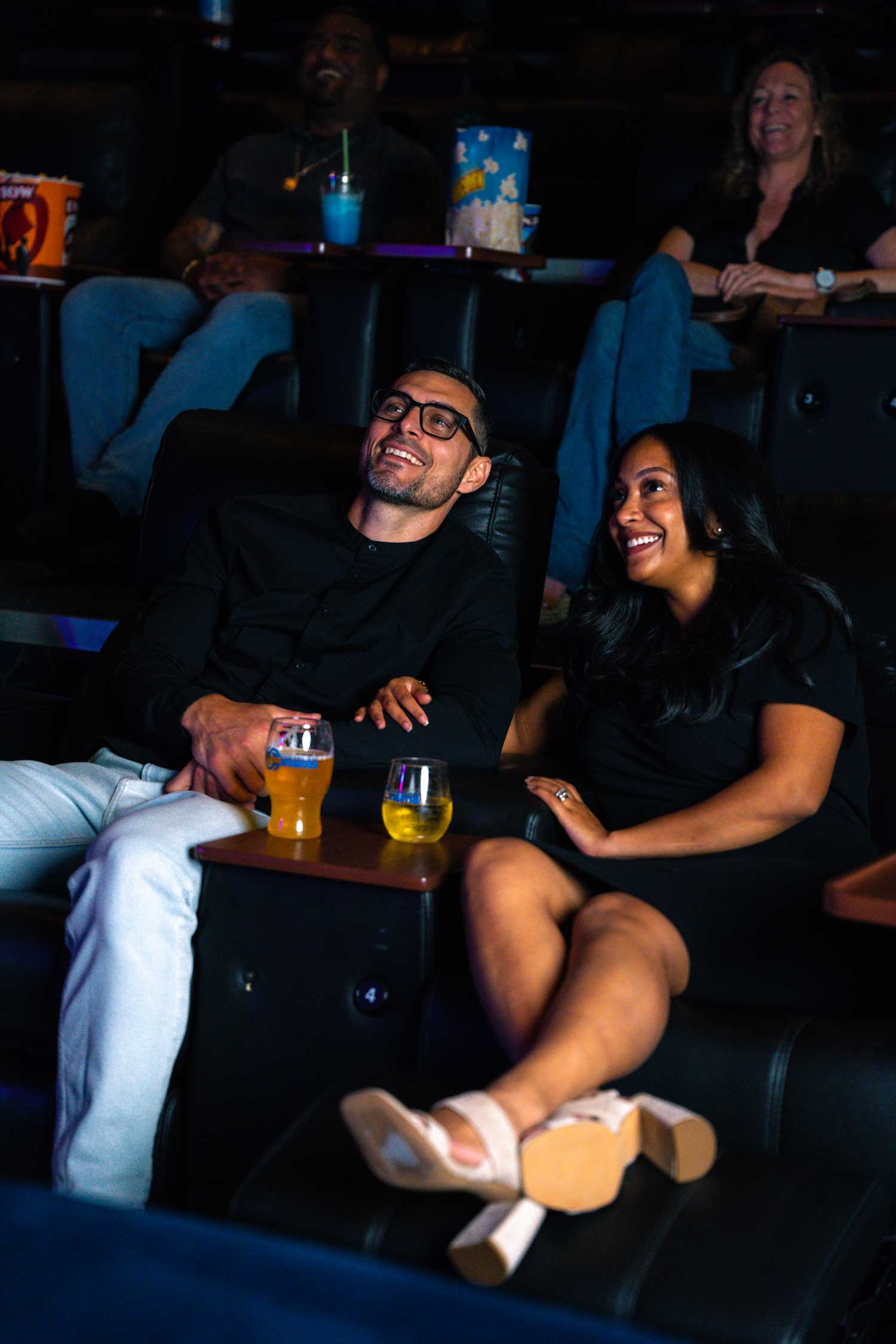 Couple sitting in movie theater