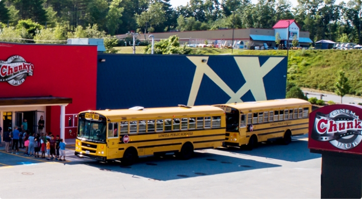 School buses in front of a Chunky's theater