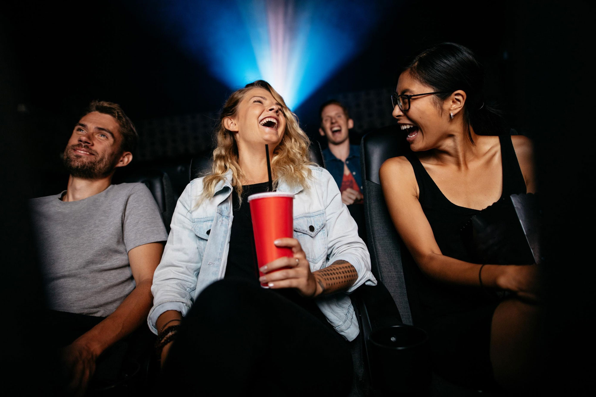 Audience laughing in theater
