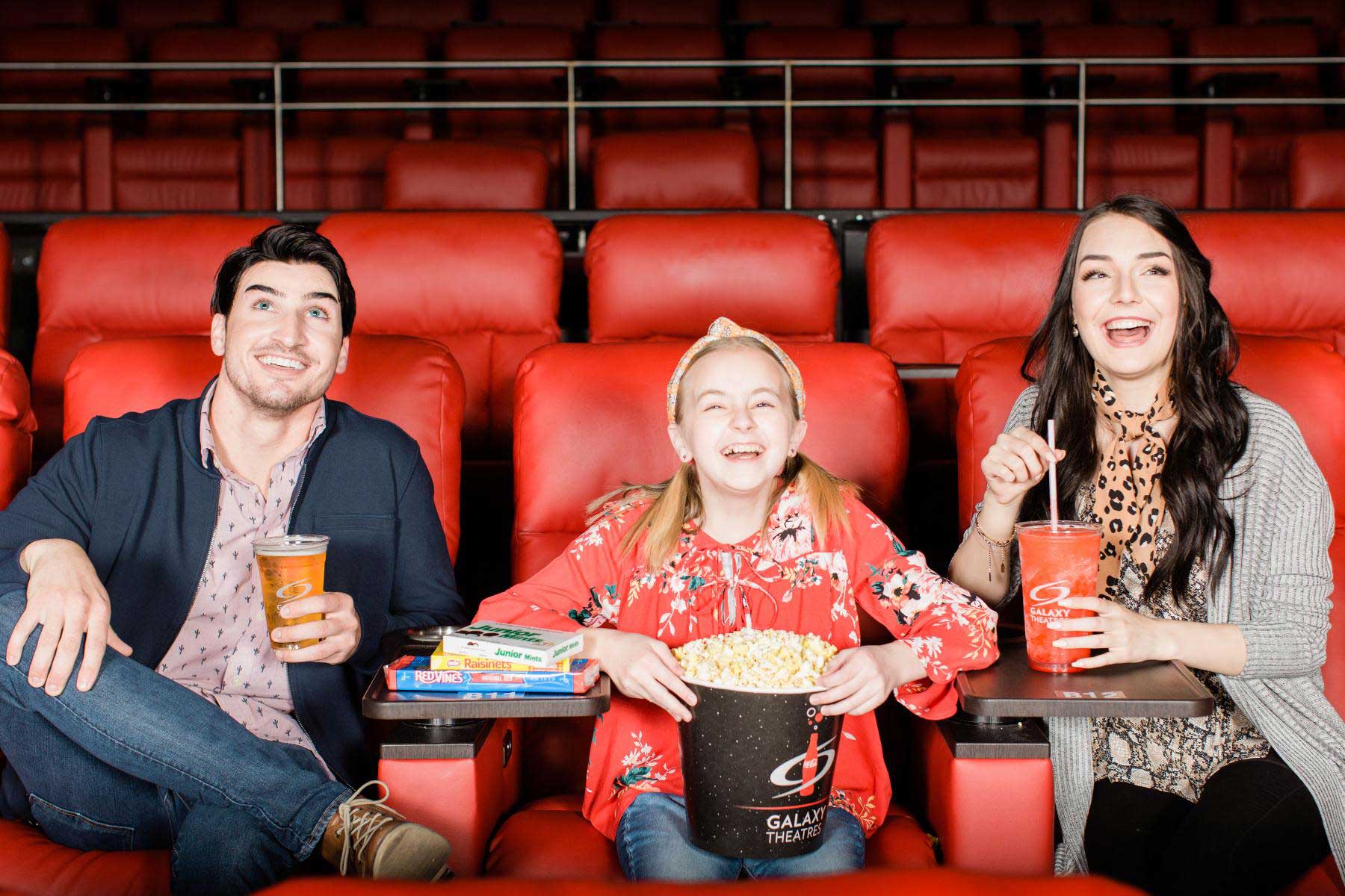 Family laughing in theater