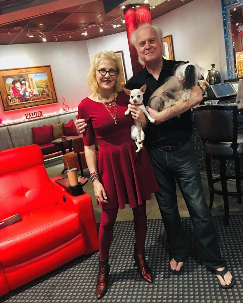 Park Plaza Cinema owners, Larry and Lucy, standing with their dogs