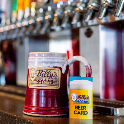 Billy's Grille mug and Beer card in front of beer taps