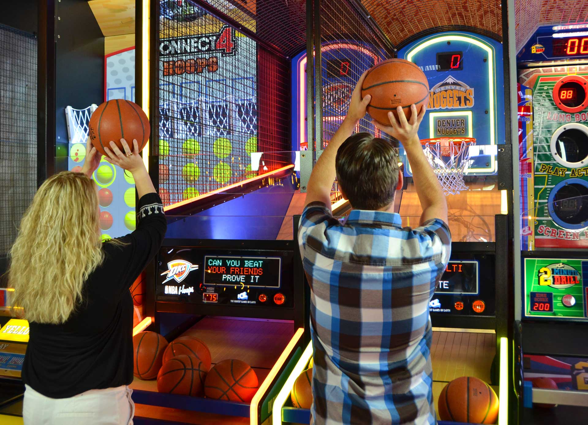 People playing air hockey