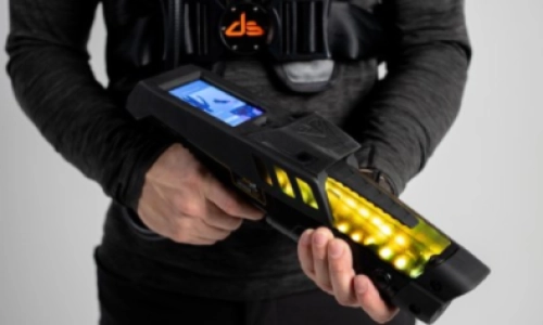 Person holding laser tag guns