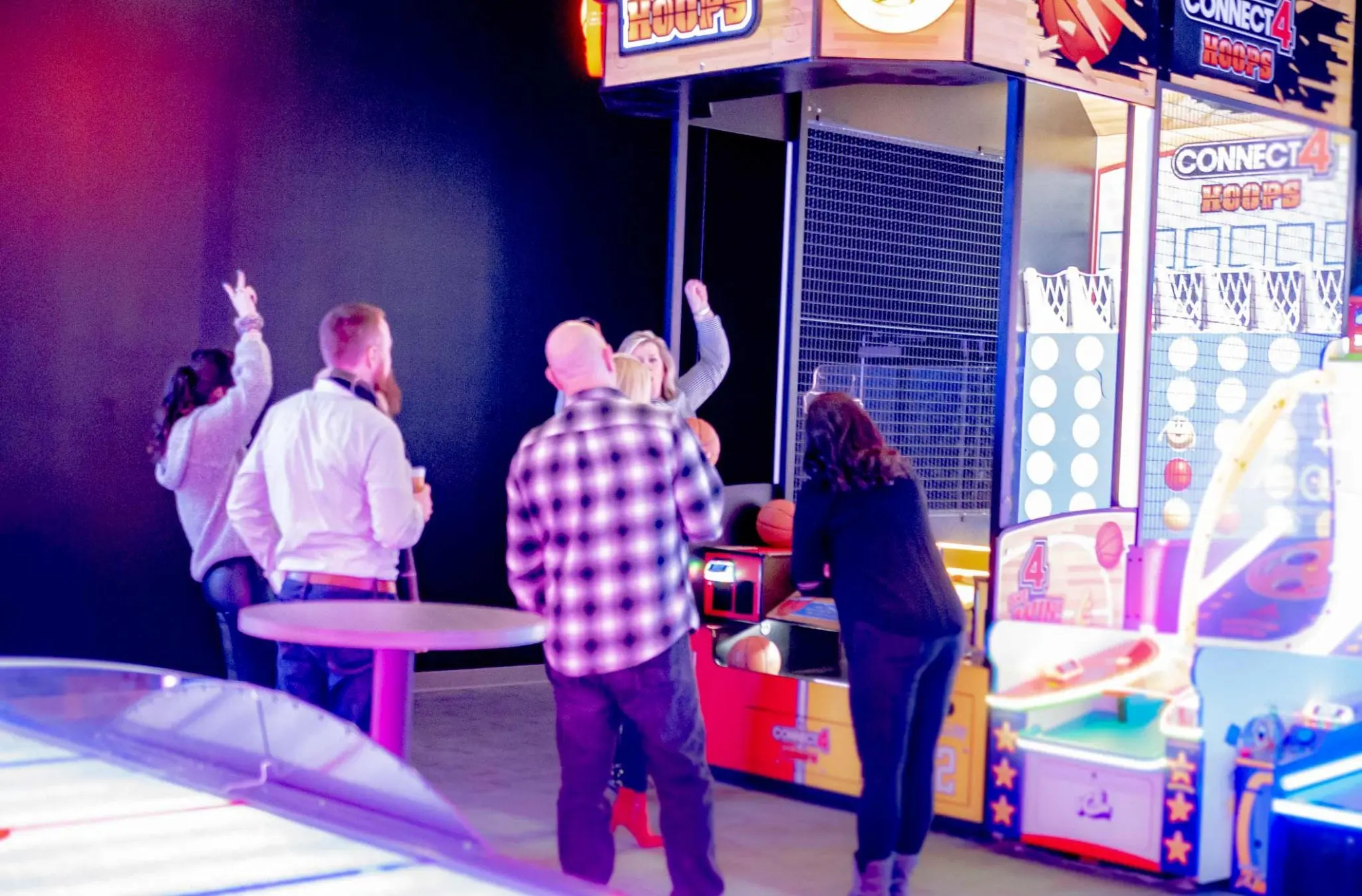 People playing basketball game in arcade