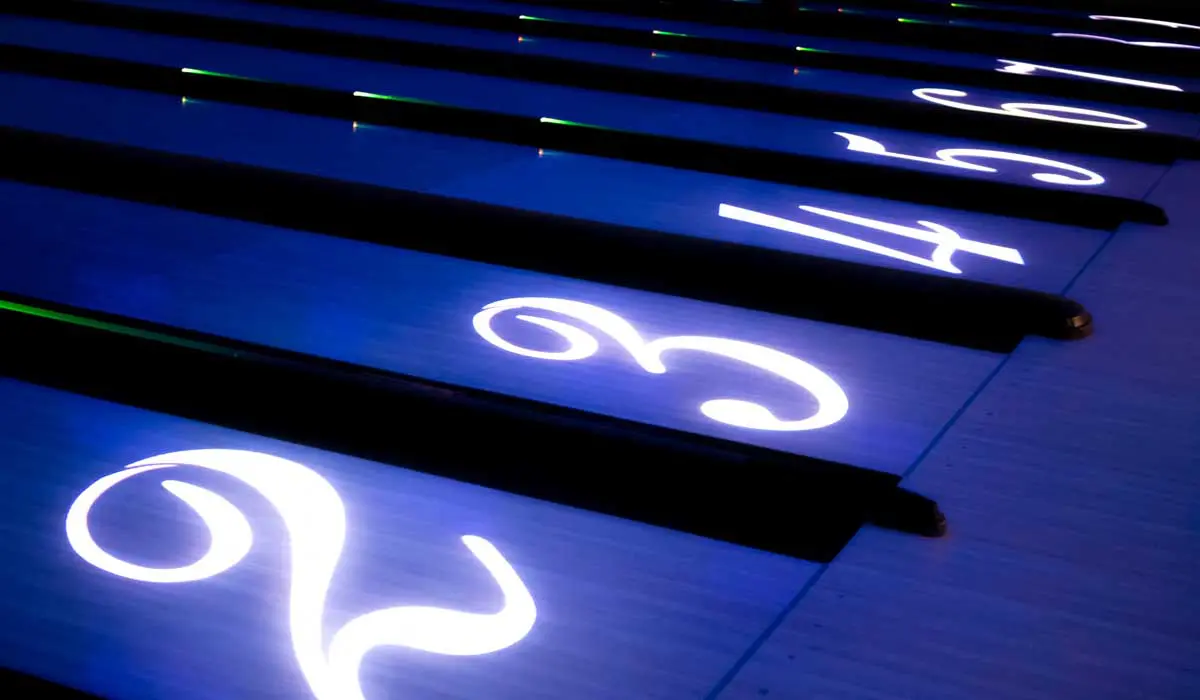 Bowling lane numbers projected on the lanes