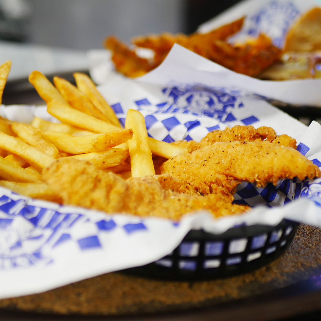 Basket with Fried Chicken and French Fries