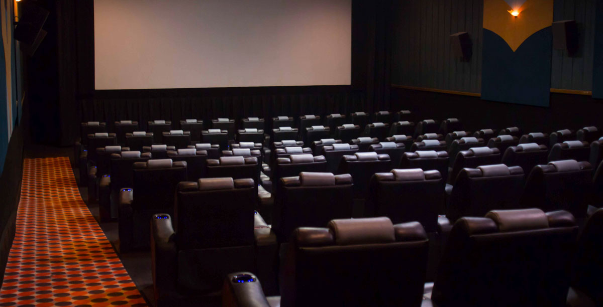 Auditorium seats and screen from the back