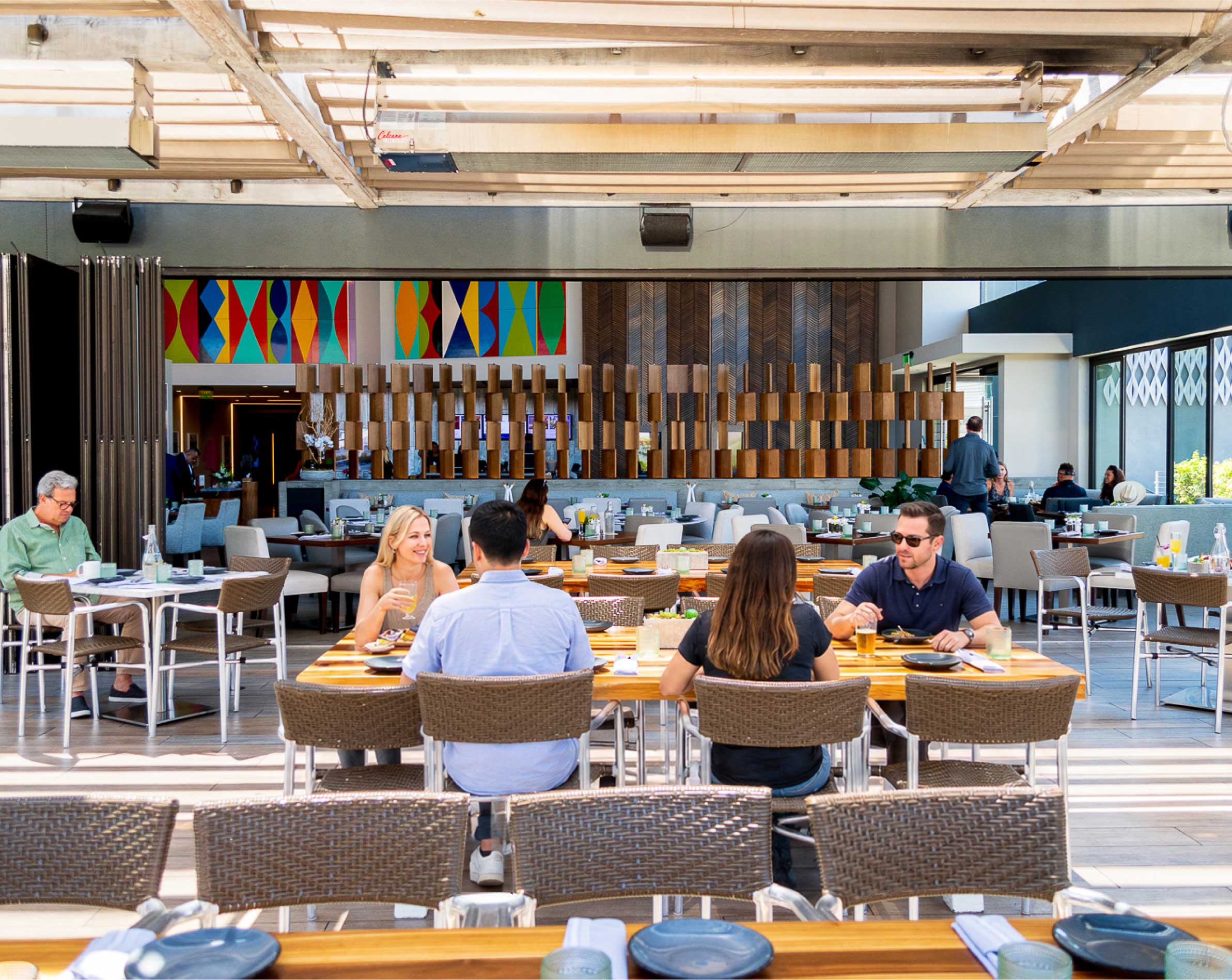 People sitting at a table on a patio