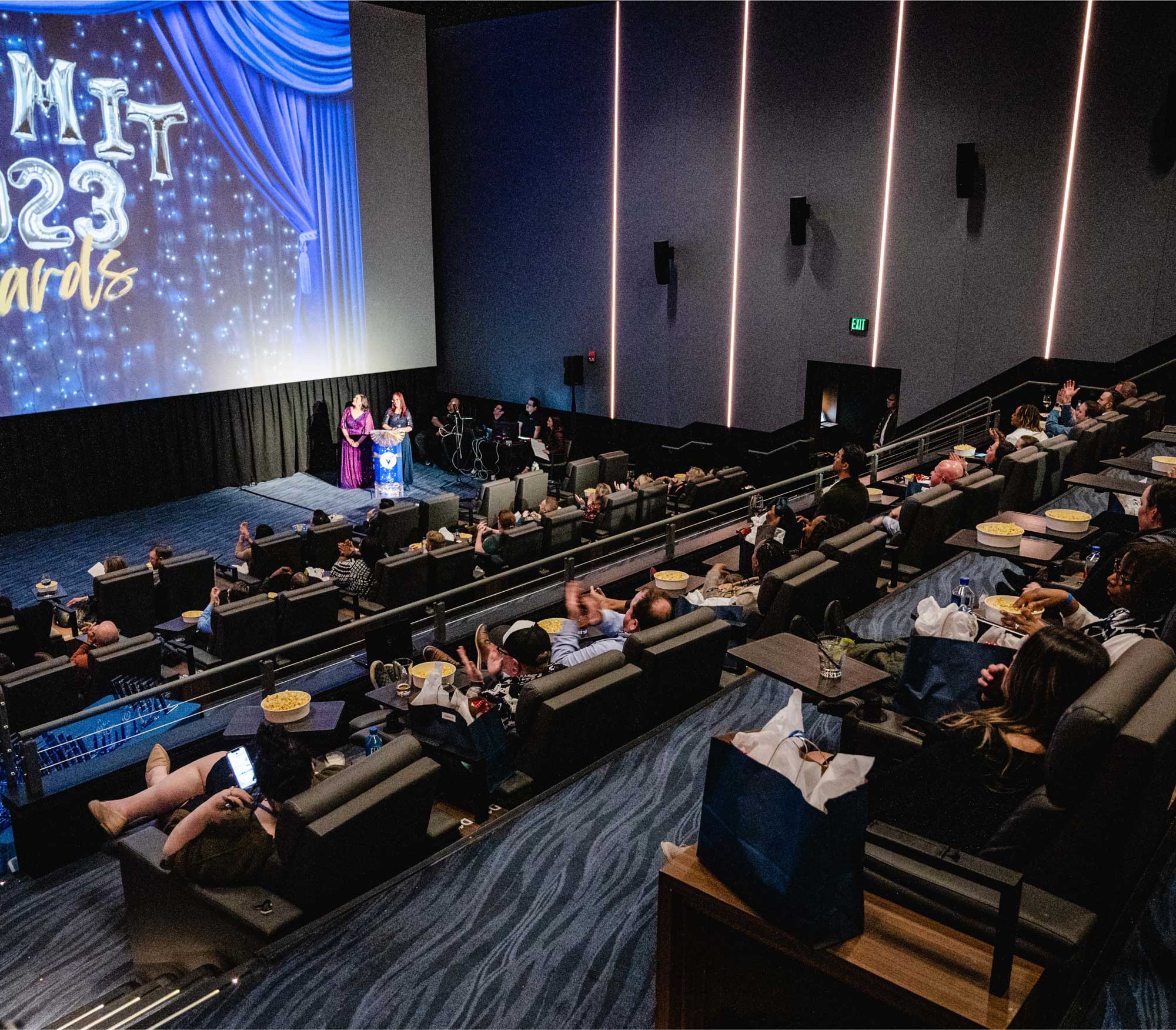 people sitting in a theater auditorium