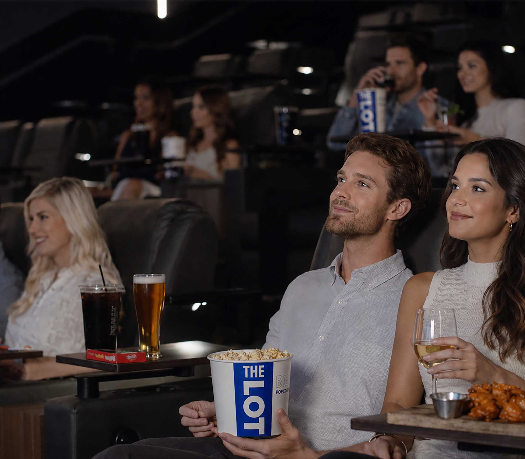 people sitting in a theater auditorium